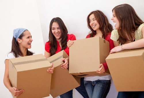 Trained moving staff using careful lifting techniques during a Shepherds Bush move