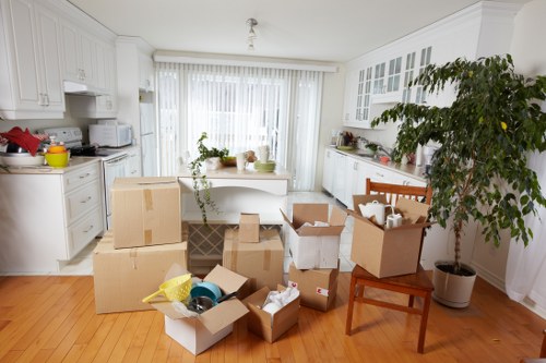 Moving boxes and furniture being loaded for transport