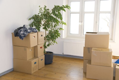 Loading household boxes into a moving van near Shepherds Bush