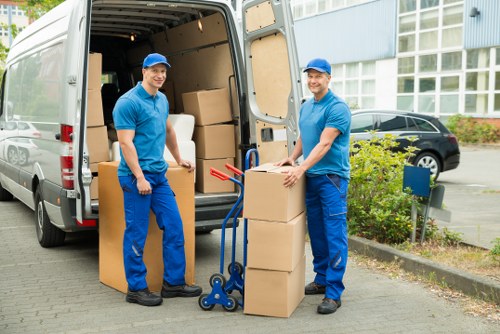 Removal van and moving crew handling a domestic relocation in Shepherds Bush