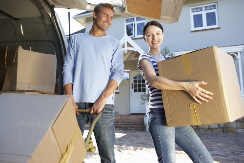 Careful loading of office furniture for a business move in Shepherds Bush